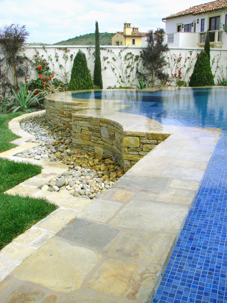 Blue Hawaiian Pools for a Mediterranean Pool with a River Rock and Ams Landscape Design Studios by Ams Landscape Design Studios, Inc.