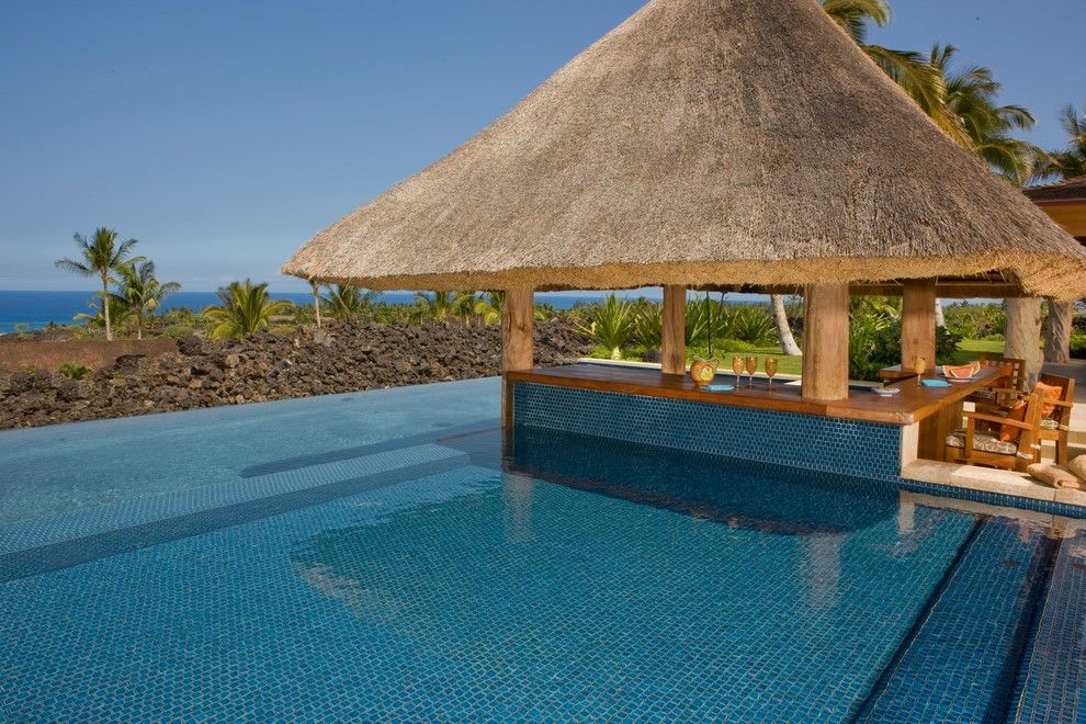 Blue Hawaiian Pools for a Tropical Pool with a Wood Post and Kona Coast by Saint Dizier Design