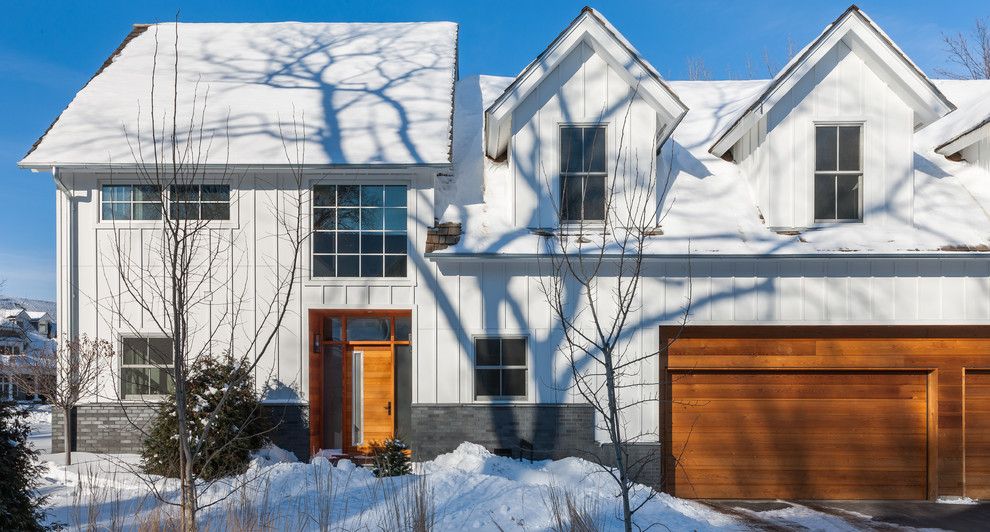 Board and Batten for a Transitional Exterior with a Board and Batten Siding and Classic Contemporary Home by Boyer Building Corporation