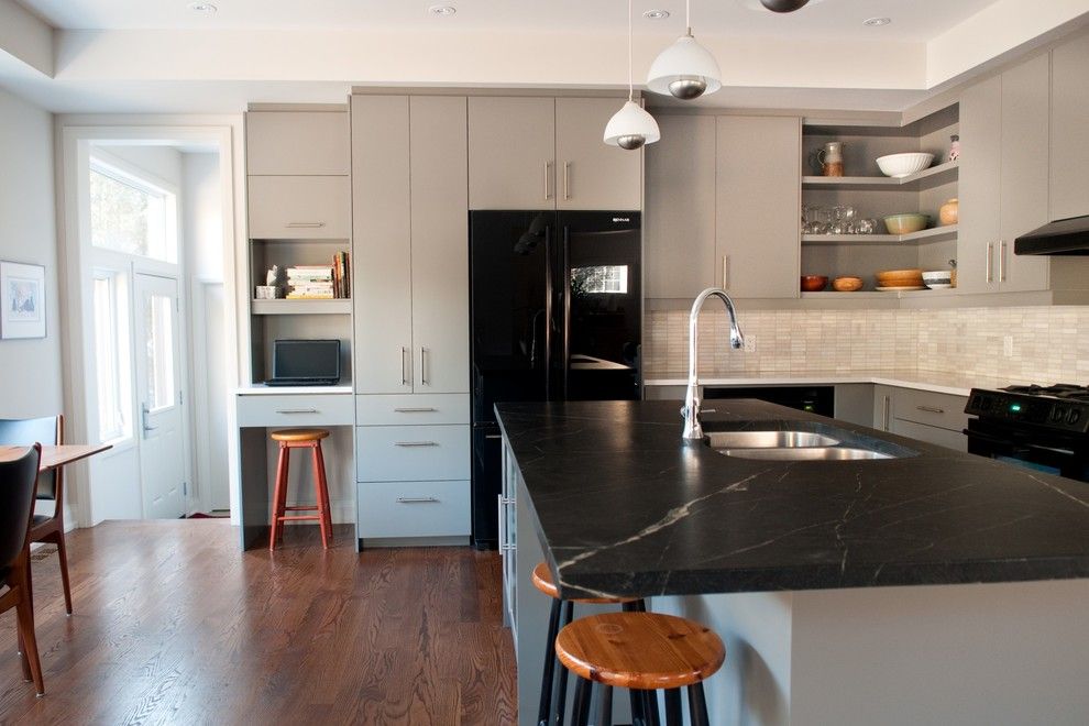 Bob Wallace Appliance for a Modern Kitchen with a Range Hood and Heather & Bob by Cabinetworks Plus