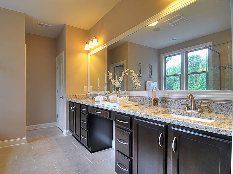 Bonterra Builders for a Traditional Bathroom with a Darkwood Cabinets and Interiors by Bonterra Builders