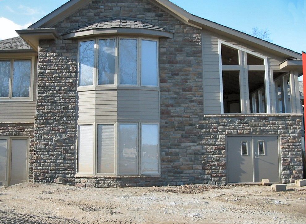 Boral Cultured Stone for a Traditional Exterior with a Cultured Stone and Boral Cultured Stone   Limestone by Brighton Stone & Fireplace, Inc.