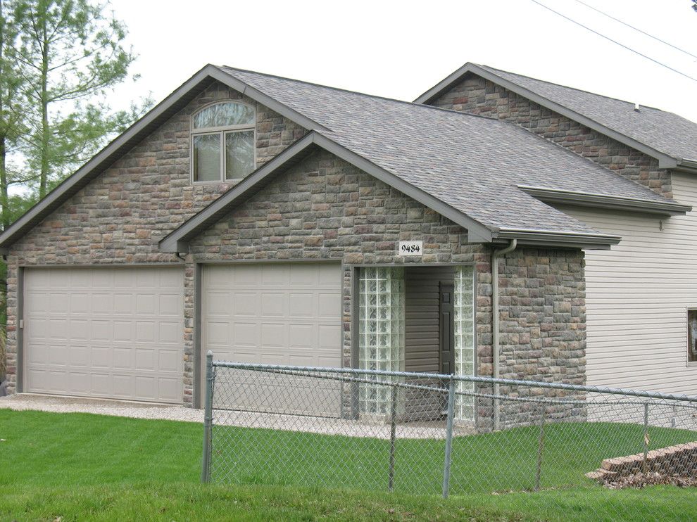 Boral Cultured Stone for a Traditional Exterior with a Garage Doors and Boral Cultured Stone   Limestone by Brighton Stone & Fireplace, Inc.