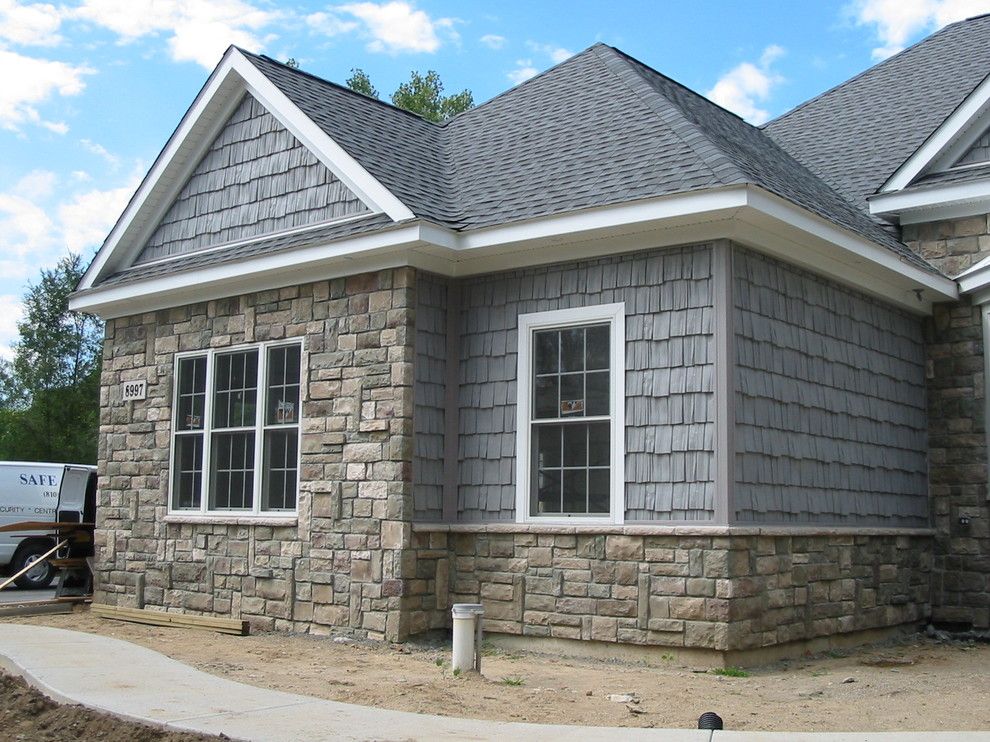 Boral Cultured Stone for a Traditional Exterior with a Shake Siding and Boral Cultured Stone   Cobblefield by Brighton Stone & Fireplace, Inc.