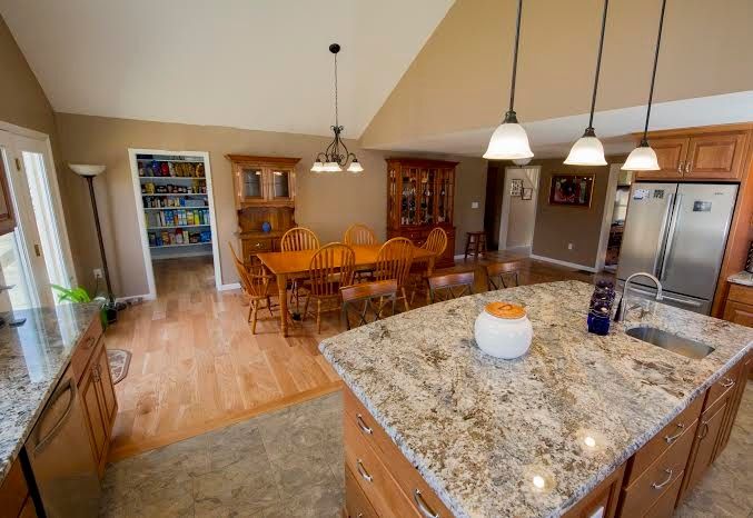 Boston Granite Exchange for a Traditional Kitchen with a Tile Floor and Kitchen Remodeling by Razzano Homes and Remodelers, Inc.