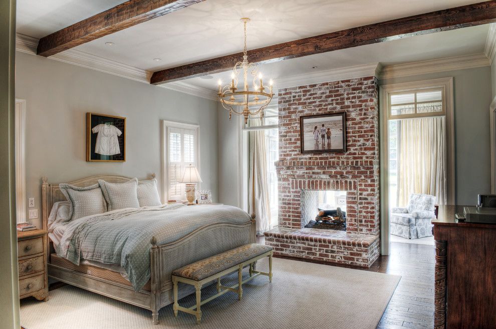 Brick Fireplace Makeover for a Traditional Bedroom with a Carved Wood and Gabriel Builders by Gabriel Builders Inc.