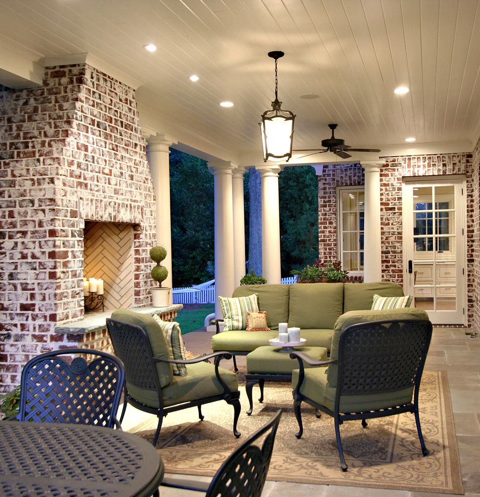 Brick Fireplace Makeover for a Traditional Porch with a Wood Ceiling and Back Porch by Dresser Homes