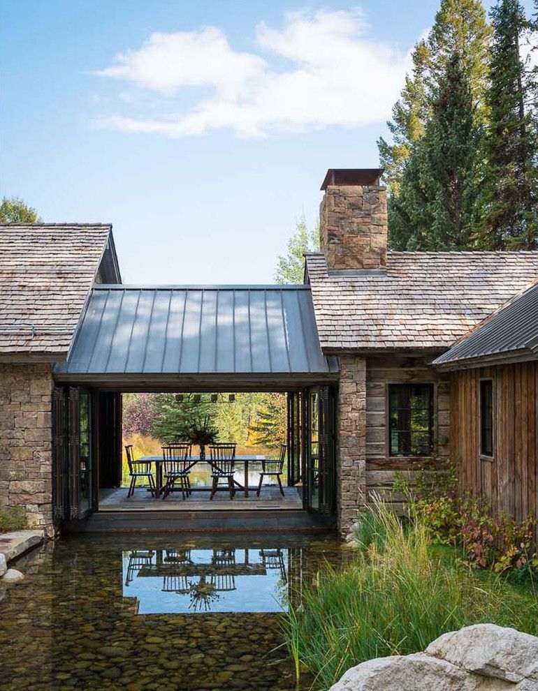 Bridger Steel for a Rustic Exterior with a Chimney Hood and Traditional Exterior by Jlfarchitects.com