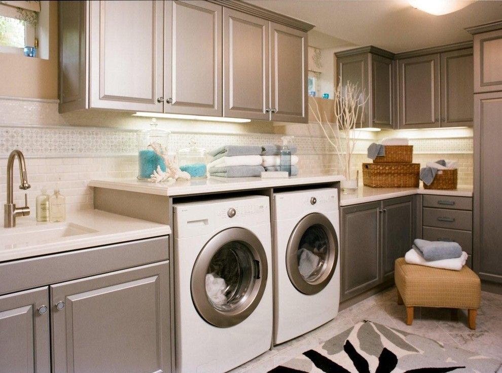 Cabinet Knob Placement for a Traditional Laundry Room with a Area Rug and Reaume Construction & Design by Reaume Construction & Design