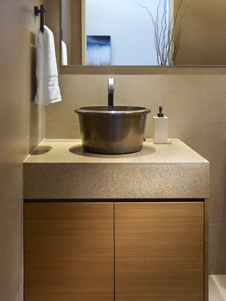 Caesarstone for a Contemporary Powder Room with a Vessel Sink and While at Chil Design Group by Claudia Leccacorvi