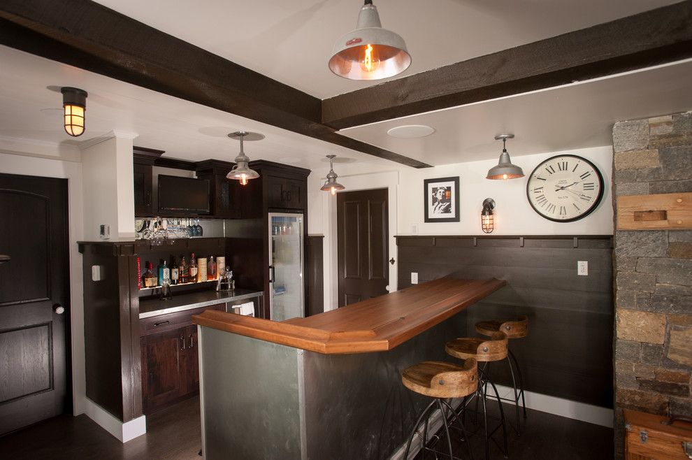 Calico Corners for a Rustic Wine Cellar with a Wood Bar Stools and Lake George Retreat by Phinney Design Group