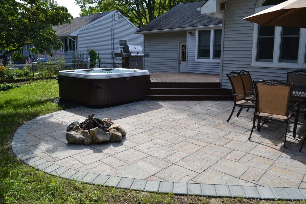 Cambridge Pavers for a Traditional Patio with a Swimming Pools and Hot Tub Bullfrog Spas with Trex Deck and Cambridge Paver Patio by Best Hot Tubs 