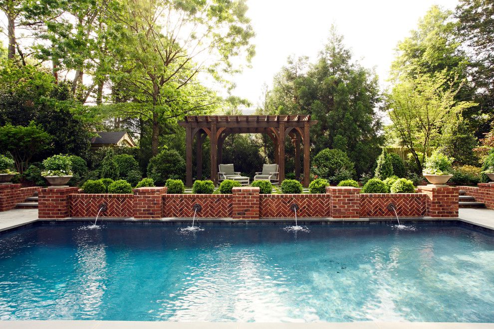 Cannon Pools for a Traditional Pool with a Low Brick Wall and 11609 by Tuckahoe Creek Construction, Inc.