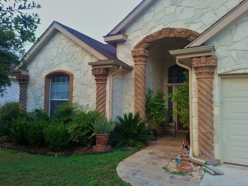 Cantera Stone for a  Exterior with a Stone Column and Columns by Cantera Stone Design, Llc