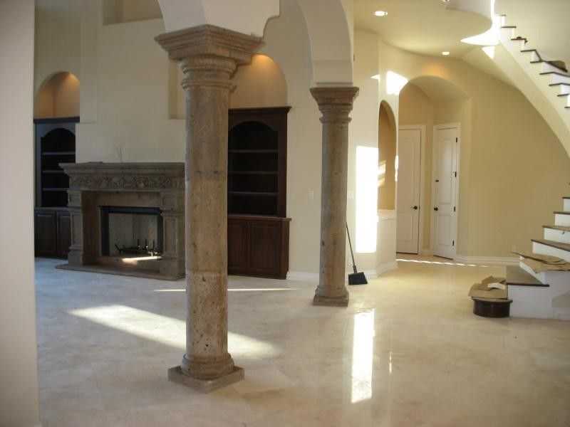 Cantera Stone for a  Living Room with a Stone Column and Columns by Cantera Stone Design, Llc