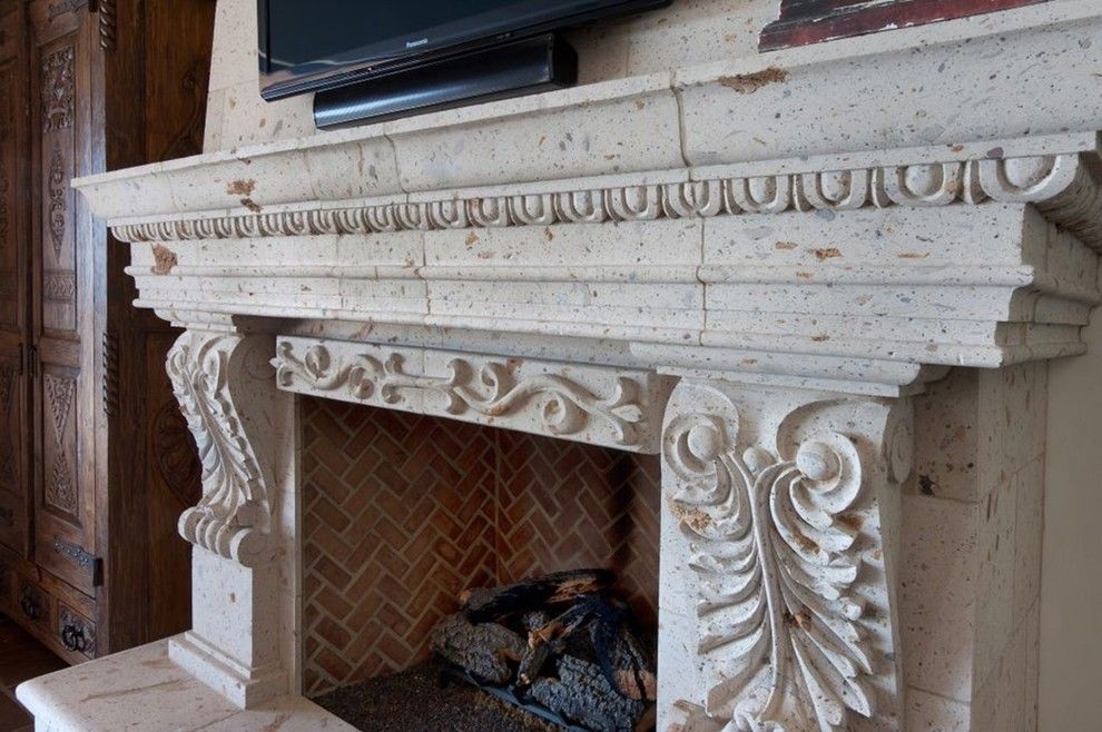 Cantera Stone for a Traditional Living Room with a Cabin Door and Cantera Stone Fireplace by Rustic Decor