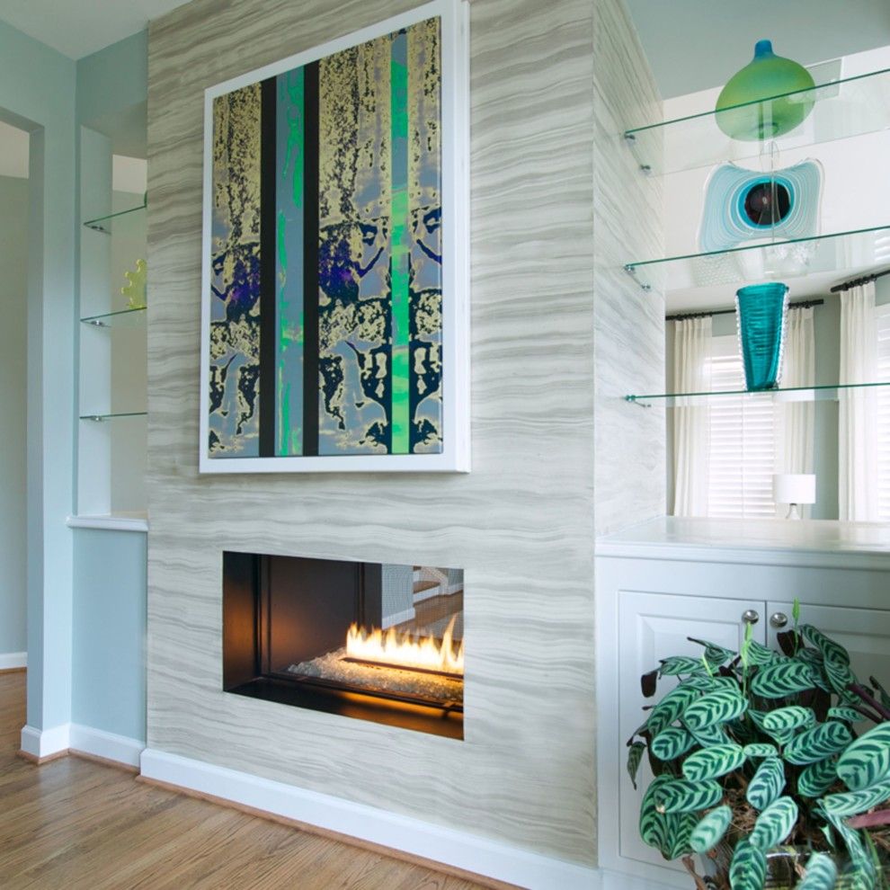 Canyon Creek Cabinets for a Modern Living Room with a Framed Art and Spark Modern Fires by Spark Modern Fires