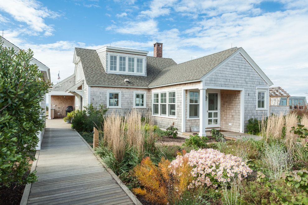 Cape Cod Lumber for a Beach Style Exterior with a Shingle Siding and Truro Cape Cod by Siberian Floors