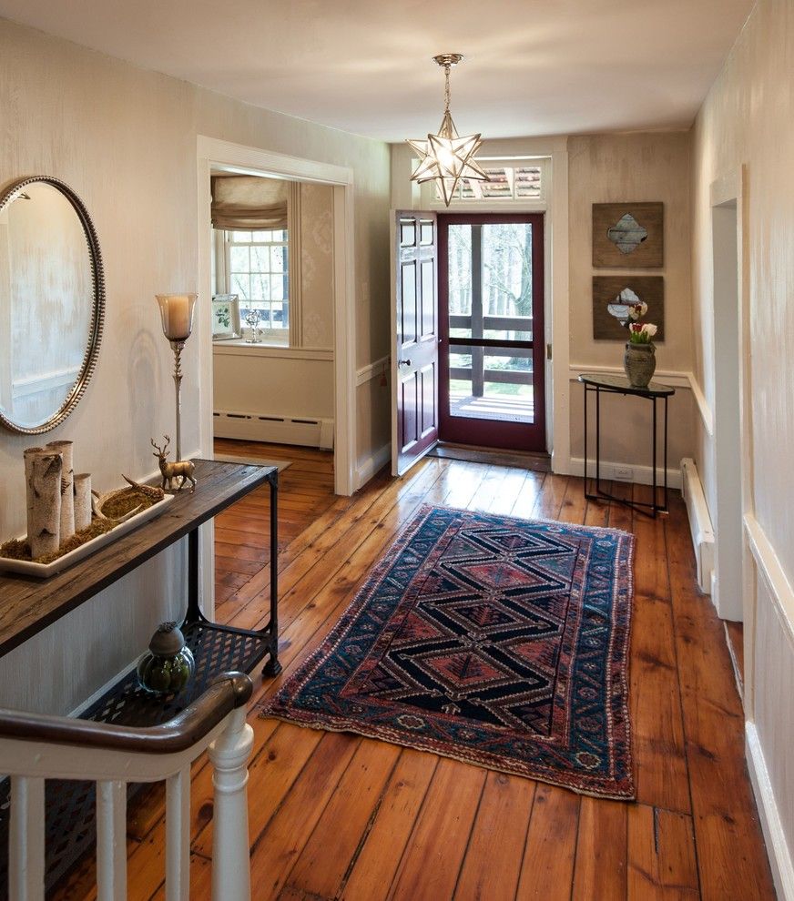 Carlisle Flooring for a Farmhouse Entry with a Star Light Fixture and Entry Foyer in 300 Year Old Farmhouse   Danziger Design by Danziger Design Llc