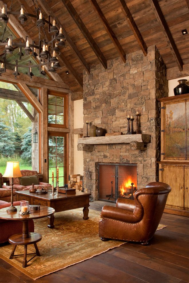 Carlisle Flooring for a Rustic Living Room with a Dark Stianed Wood and Snake River Guest House by Jlf & Associates, Inc.