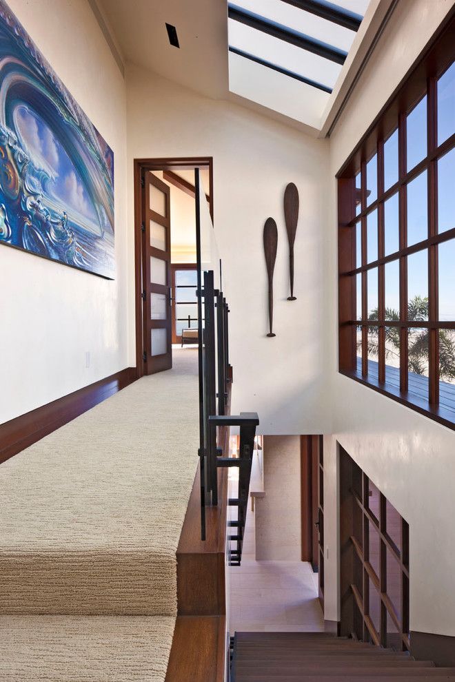 Carpeted Stairs for a Contemporary Staircase with a Large Windows and Newport Ocean Front by Jeremy Harnish Designer Finishes