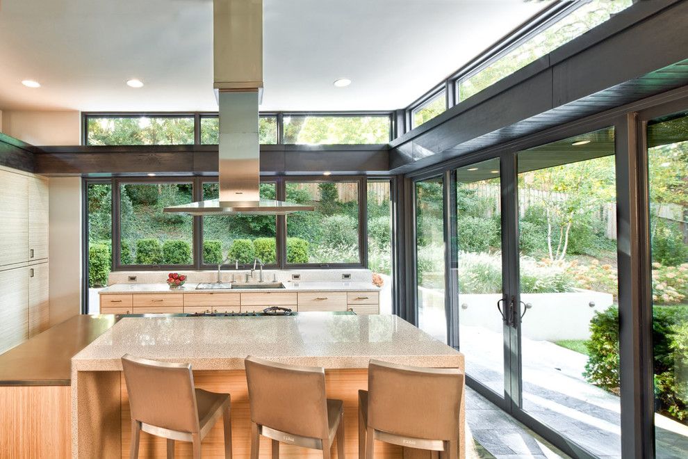 Caruso Homes for a Contemporary Kitchen with a Waterfall Countertop and Marvin Windows and Doors by Marvin Windows and Doors