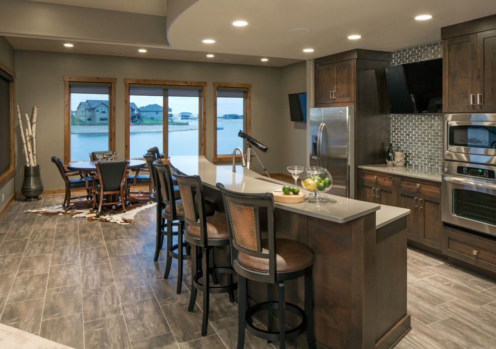 Celebrity Homes Omaha for a Transitional Basement with a Dark Stained Wood and Rustic Chic Lakehouse by Spaces Interiors/exteriors