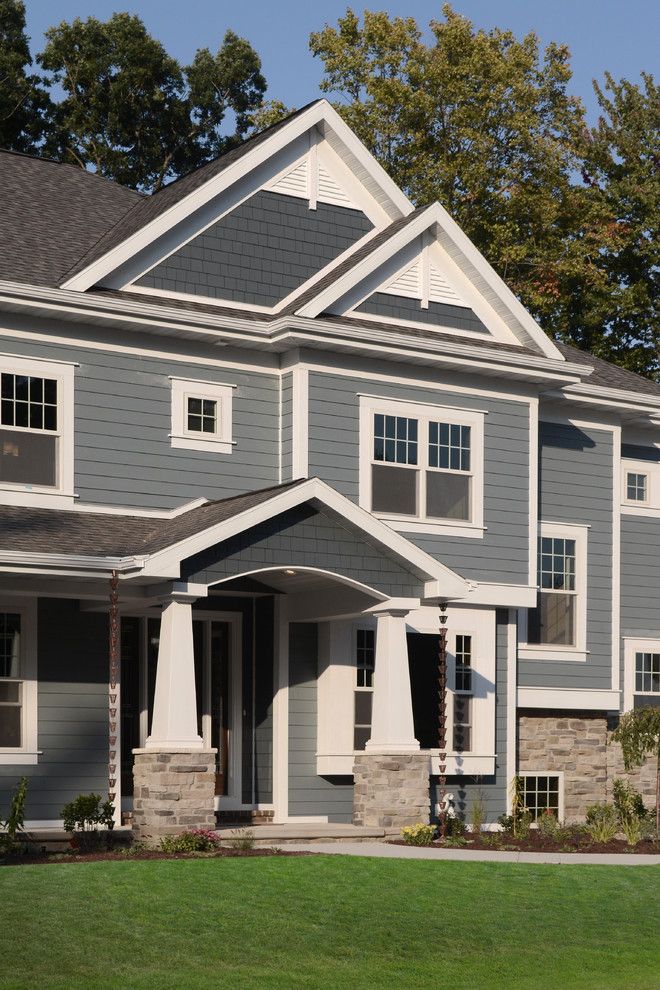 Certainteed Landmark Shingles for a Contemporary Exterior with a Fiber Cement Shakes and Fall 2012 Parade Home by Radue Homes Inc.