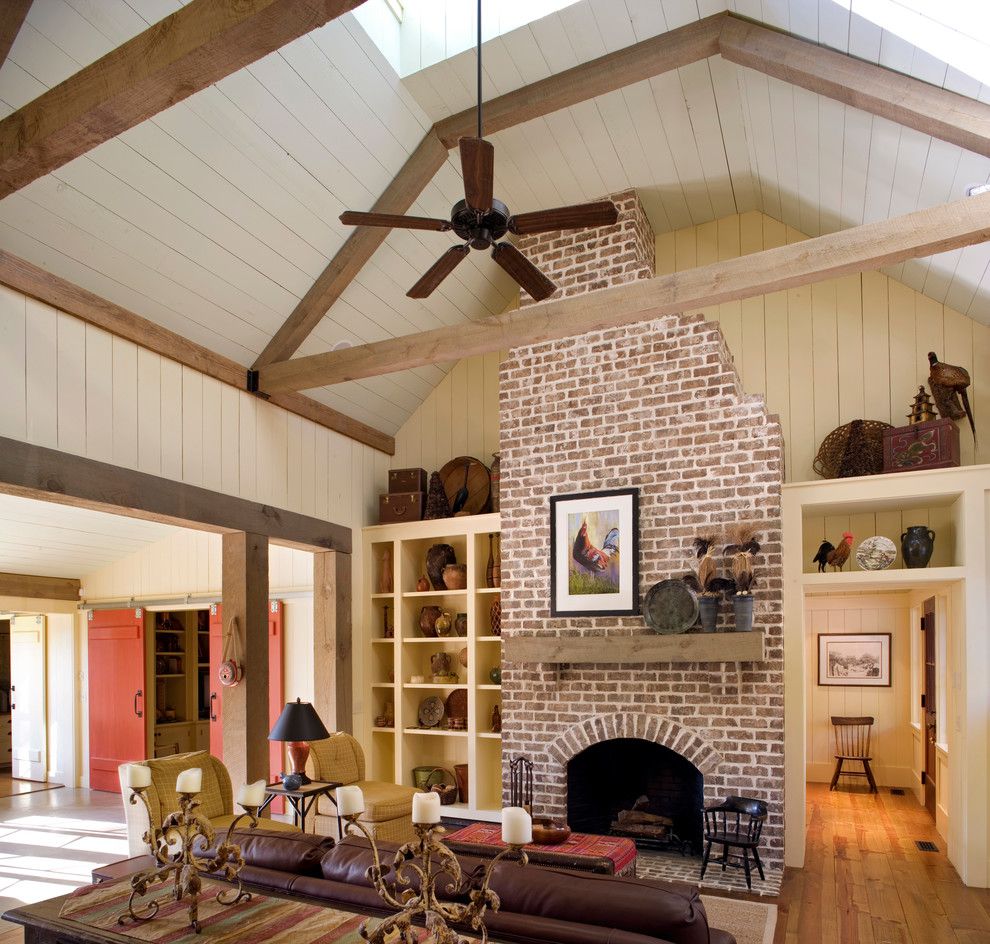 Cherokee Brick for a Rustic Family Room with a Vaulted Ceiling and Barn Retreat by Historical Concepts