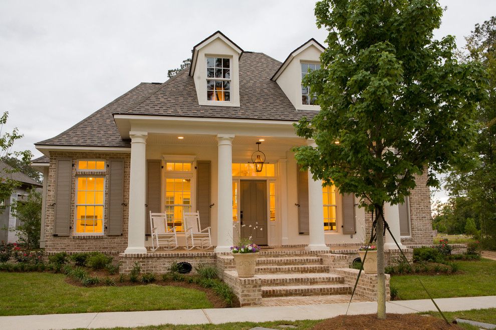 Cherokee Brick for a Traditional Exterior with a Beige Shutters and Traditional Front Porch by Highland Homes, Inc.