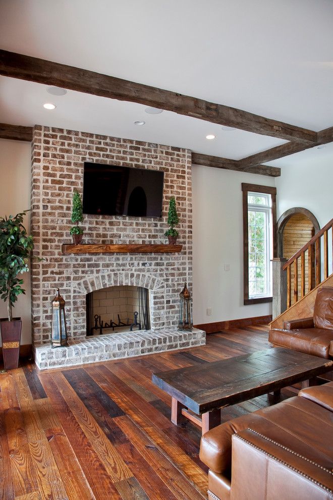 Cherokee Brick for a Traditional Living Room with a Brick Fireplace and Chateau De Charleston by Ink Architecture + Interiors