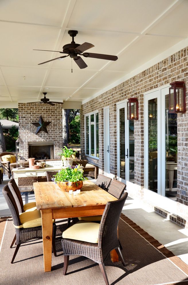 Cherokee Brick for a Traditional Patio with a Wood Dining Chair and Pensacola Waterfront by Sprague Construction