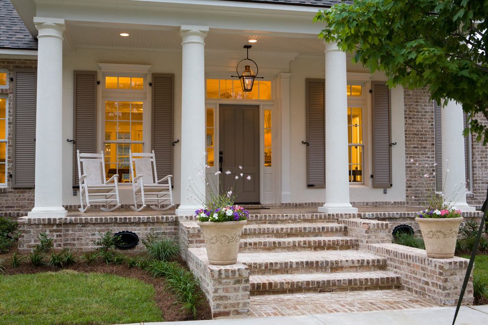 Cherokee Brick for a Traditional Porch with a White Posts and Traditional Front Porch by Highland Homes, Inc.