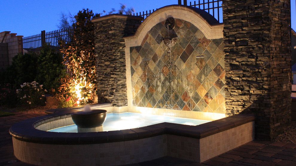 Chip N Dales for a Mediterranean Landscape with a Cultured Stone Veneer and Water Features by Chip N Dale's Custom Landscaping