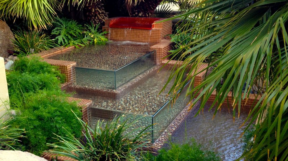 Chip N Dales for a Tropical Landscape with a Natural Stone and Water Features by Chip N Dale's Custom Landscaping