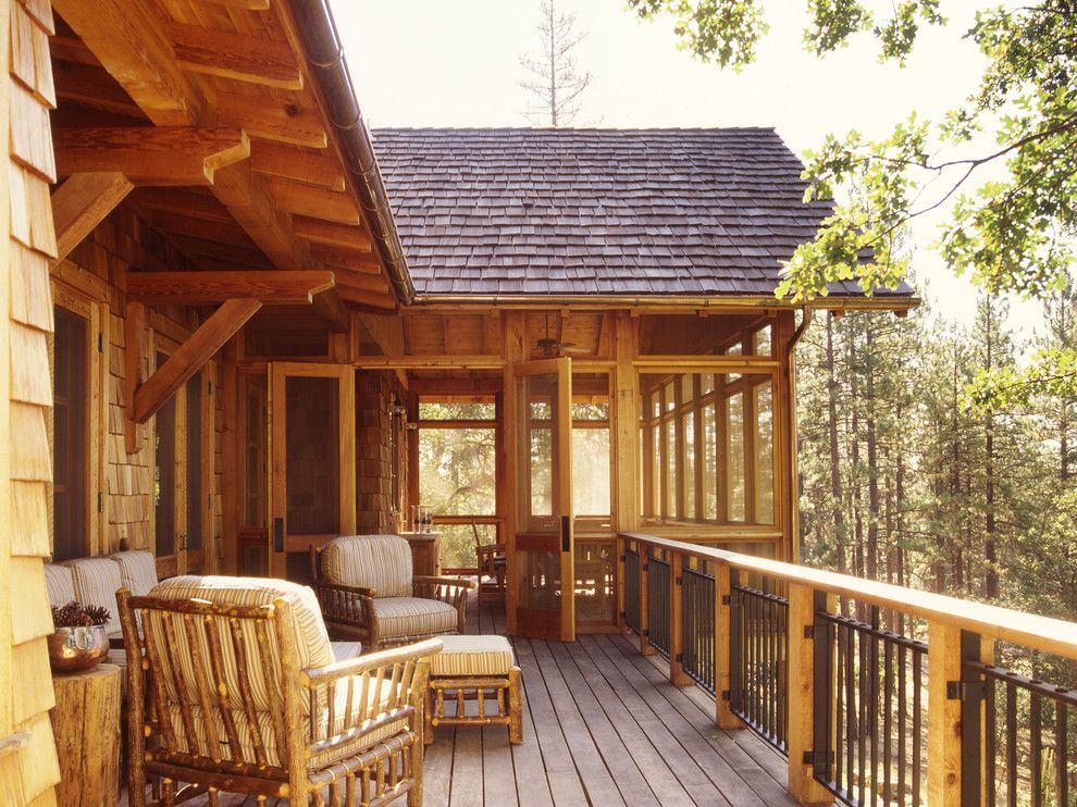 Chippewa Ranch Camp for a Rustic Deck with a Wood Railing and Family Ranch by Tucker & Marks