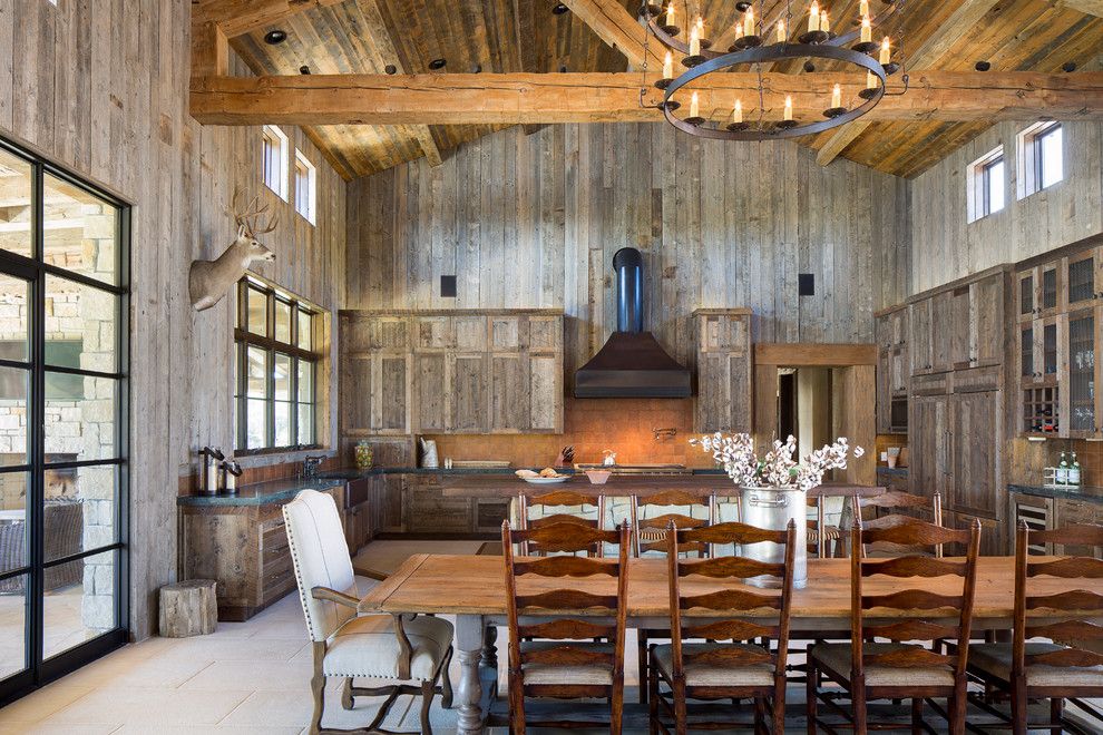 Chippewa Ranch Camp for a Rustic Dining Room with a Kitchen Island and Llano Ranch by Cornerstone Architects