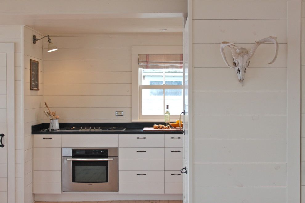 Clapboard for a Rustic Kitchen with a Antlers and Harbor Cottage, Maine by Justine Hand