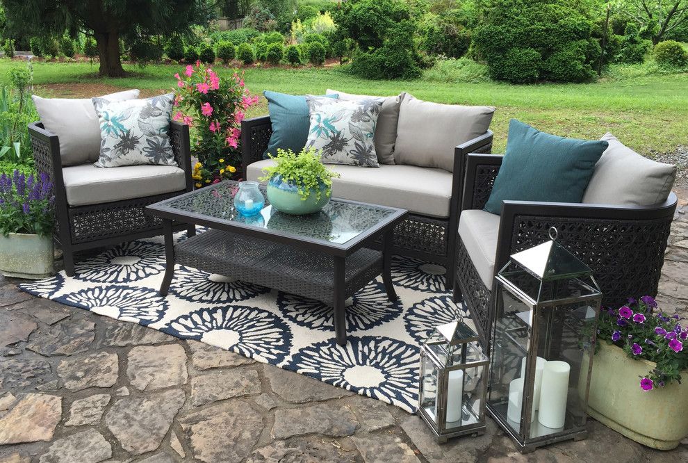 Clovis Glass for a  Patio with a Blue Pillow and Ae Outdoor by Ae Outdoor