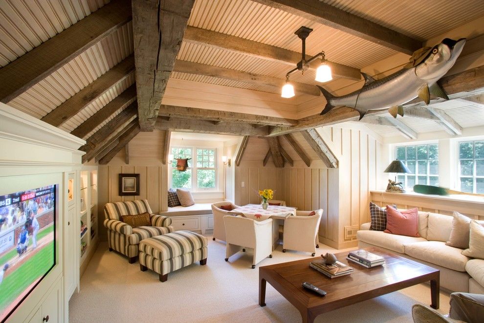 Cobblestone Wall for a Traditional Family Room with a Wood Ceiling and Robinson's Bay Residence by Murphy & Co. Design