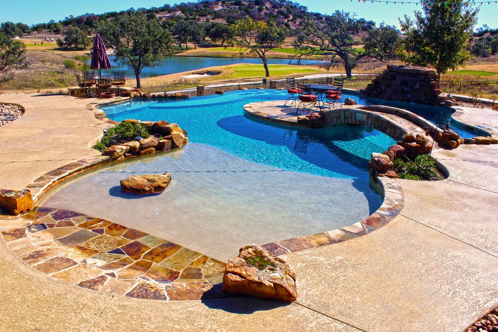 Cody Pools for a Contemporary Pool with a Tanning Ledge and Luxury Backyards by Cody Pools, Inc.