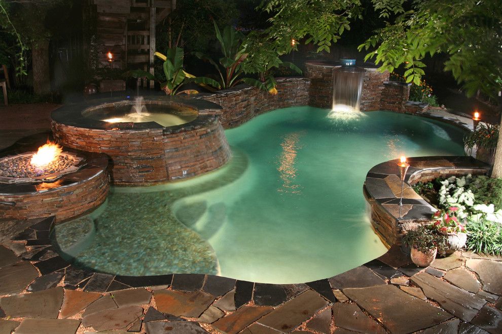 Cody Pools for a Traditional Pool with a Fire Pit and Luxury Backyards by Cody Pools, Inc.