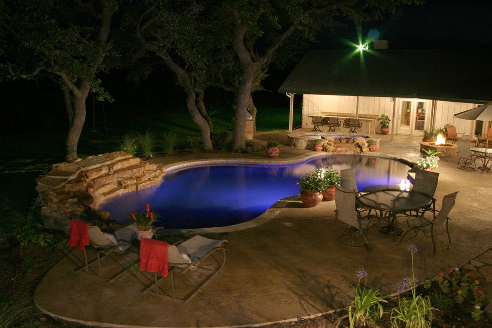 Cody Pools for a Traditional Pool with a Spa and Luxury Backyards by Cody Pools, Inc.