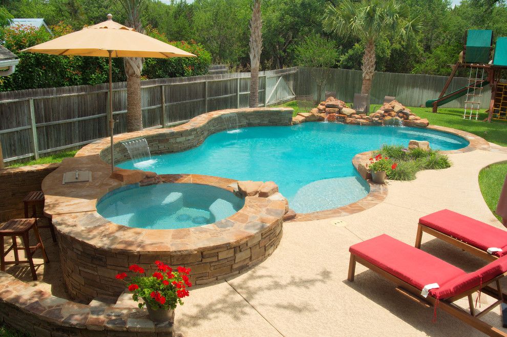 Cody Pools for a Traditional Pool with a Sundeck and Luxury Backyards by Cody Pools, Inc.