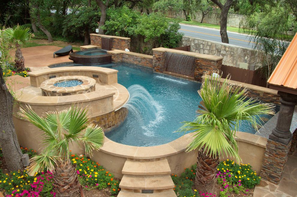 Cody Pools for a Traditional Pool with a Water Sheer and Luxury Backyards by Cody Pools, Inc.