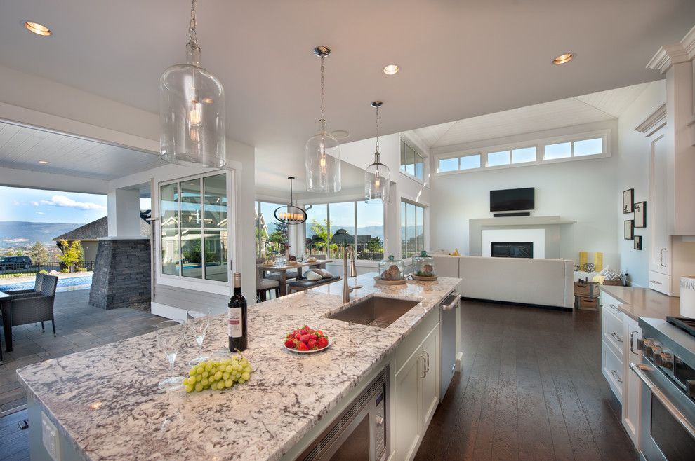 Cold Spring Granite for a Contemporary Kitchen with a Glass Bell Pendant Lights and Skylands Show Home by Sticks and Stones Design Group Inc.