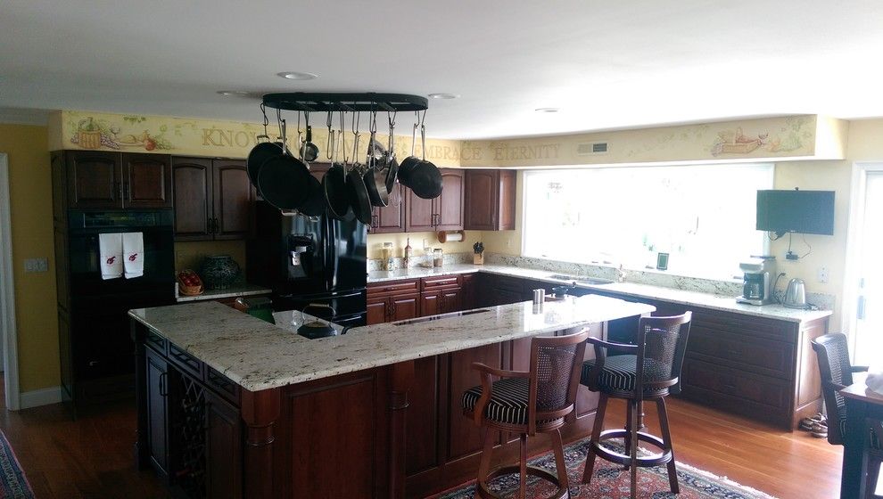 Colonial Gold Granite For A Mediterranean Spaces With A Raised Bar