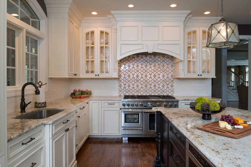 Colonial Gold Granite for a Traditional Kitchen with a Wood Hood and Leesburg River Creek Kitchen by Kim Kendall Interiors