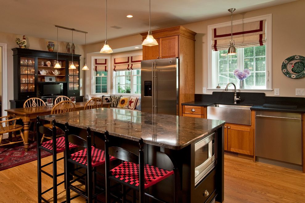 Colonial White Granite for a Traditional Kitchen with a Farmhouse Sink and Redesigned Reprieve by Teakwood Builders, Inc.