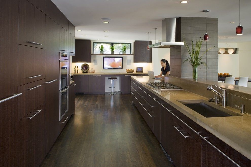 Concrete Countertop Solutions for a Contemporary Kitchen with a Stainless Steel Appliances and Kitchen by Camber Construction